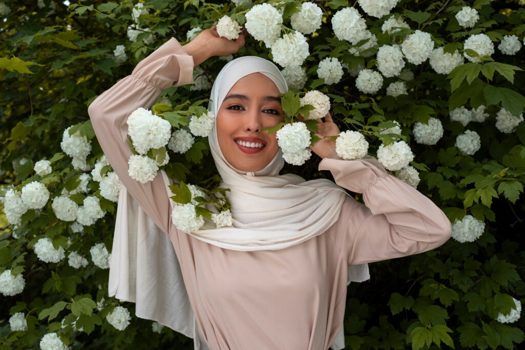 medium-shot-Muslim-woman-posing-with-flowers