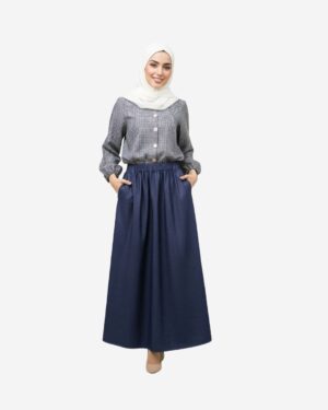 Modest denim set with a checkered linen blouse and dark denim skirt by Asmaa Basha.