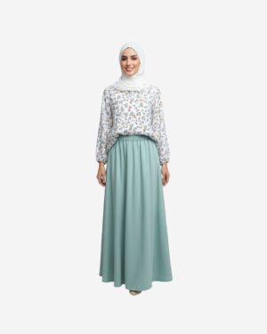 Model wearing a mint green floral cotton blouse paired with a mint linen modest skirt, styled in an elegant modest outfit by Asmaa Basha