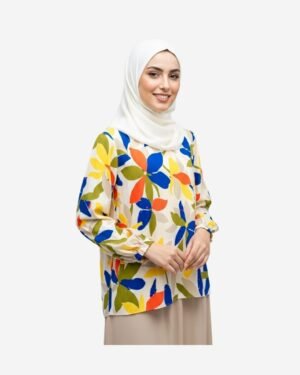 Asmaa Basha modest floral silk blouse in white with colorful leaf pattern, styled with beige skirt for elegant look