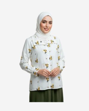 Modest white cotton blouse with elegant thread embroidery, worn by a veiled model styled for a chic everyday look.