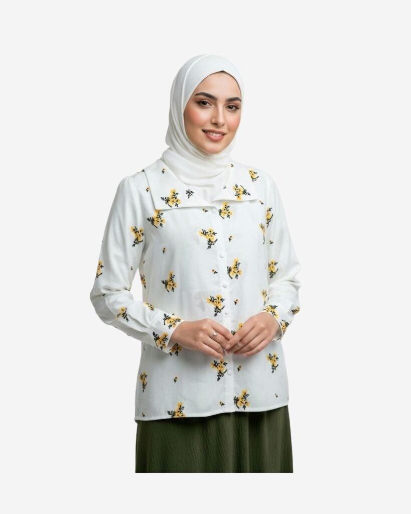 Modest white cotton blouse with elegant thread embroidery, worn by a veiled model styled for a chic everyday look.